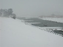 Snow falls over Tama-River